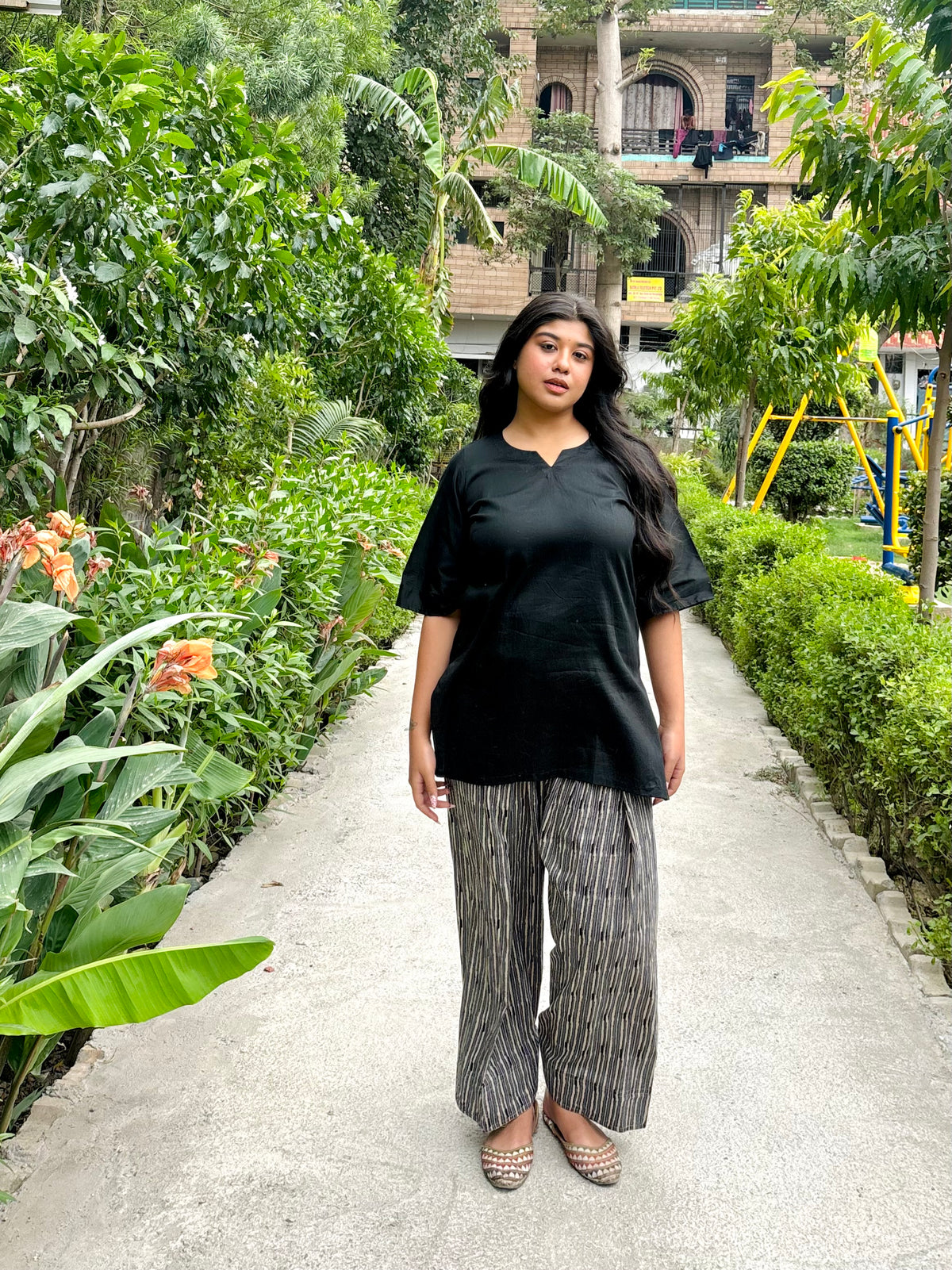 black kurti with striped farshi salwar