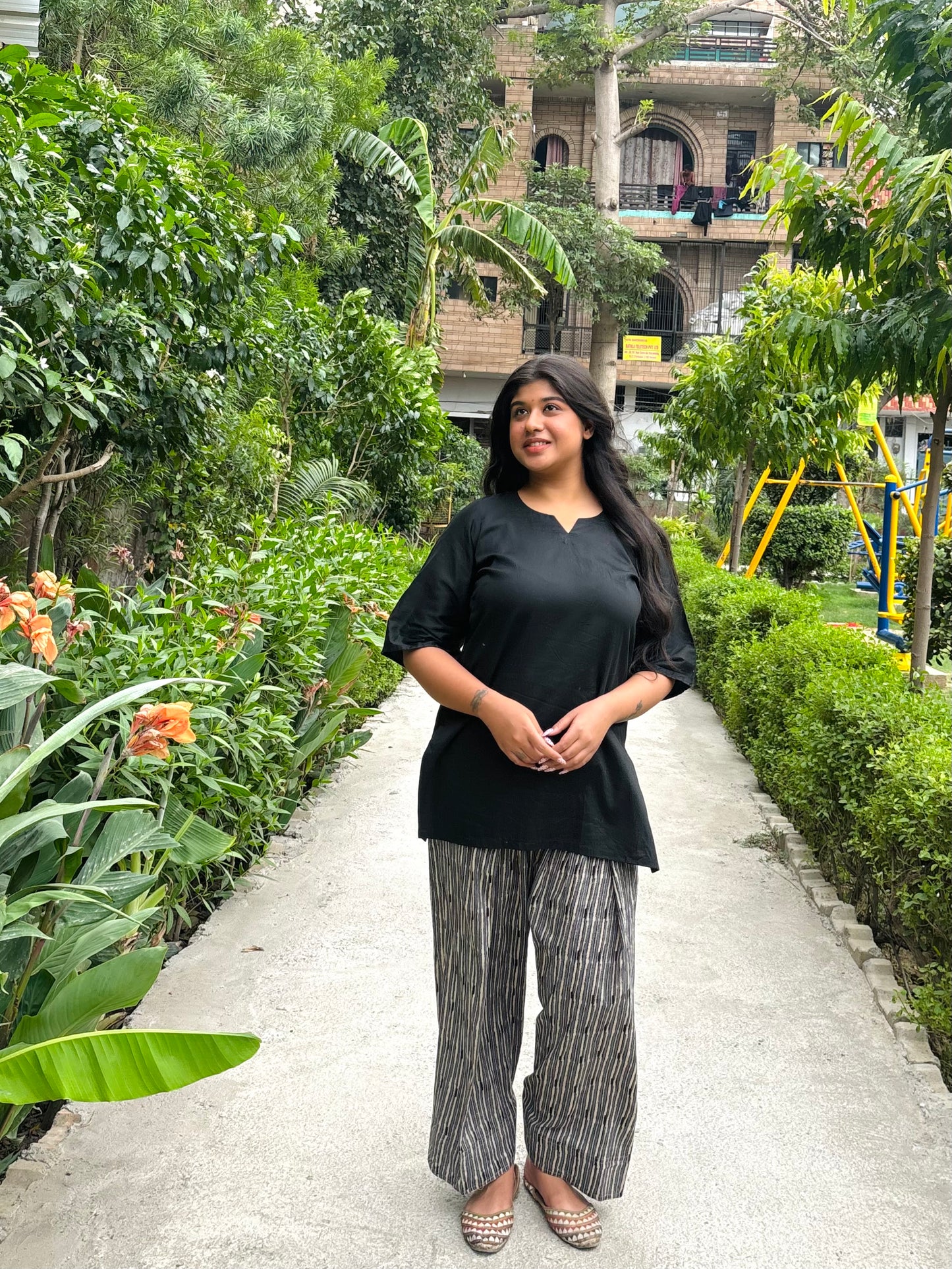 black kurti with striped farshi salwar